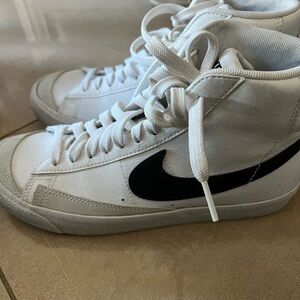 Woman’s Nike high top sneakers. No smoking home